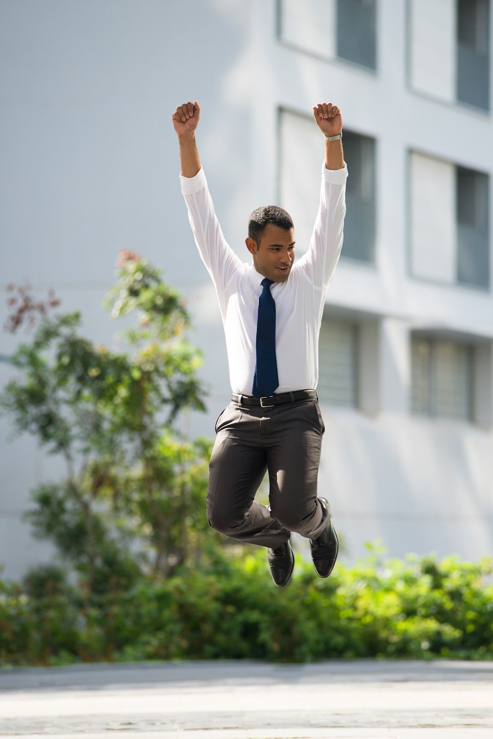 Cheerful Businessman Jumping Celebrating Success job success